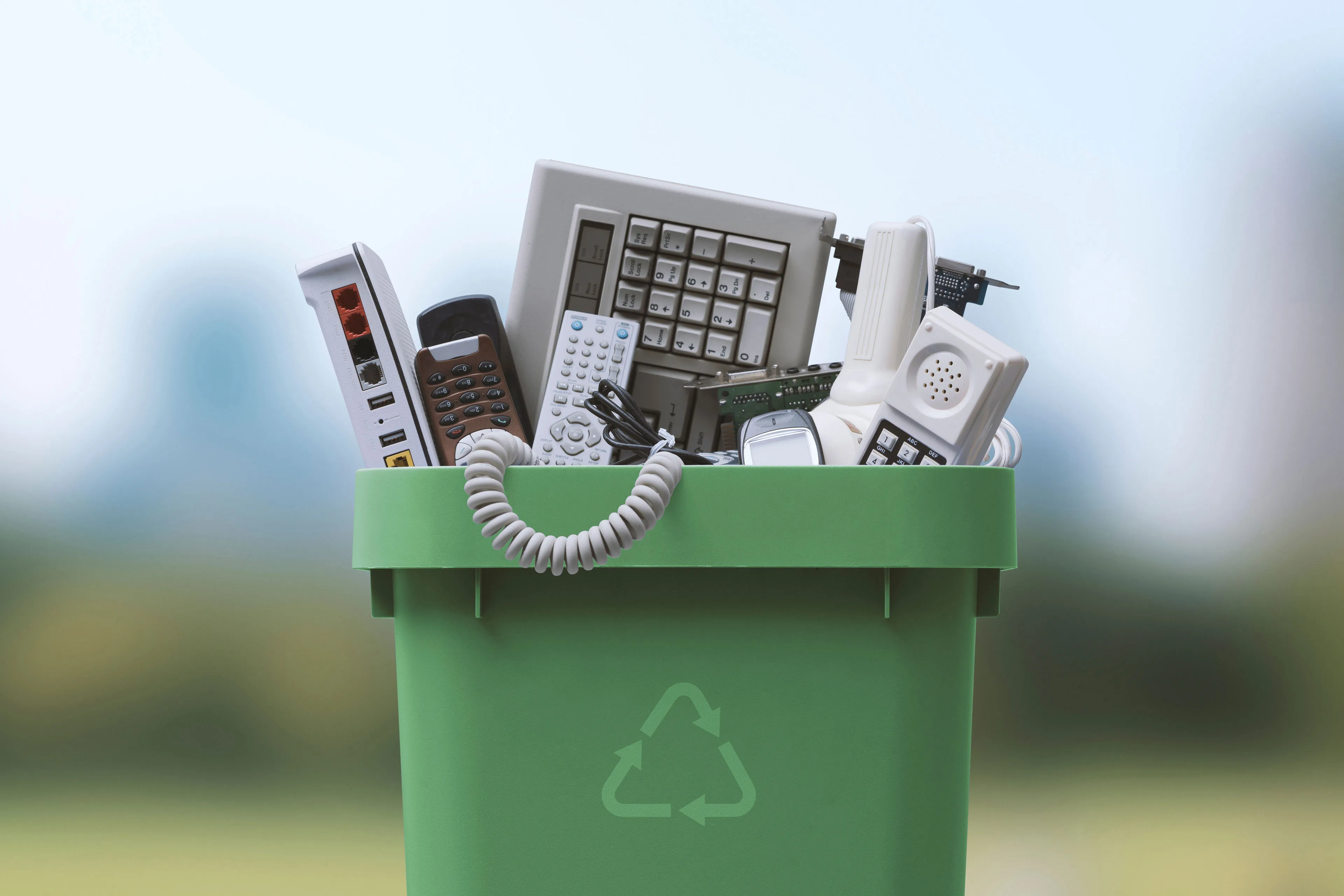 Workers handling electronic materials for recurring secure destruction and recycling.