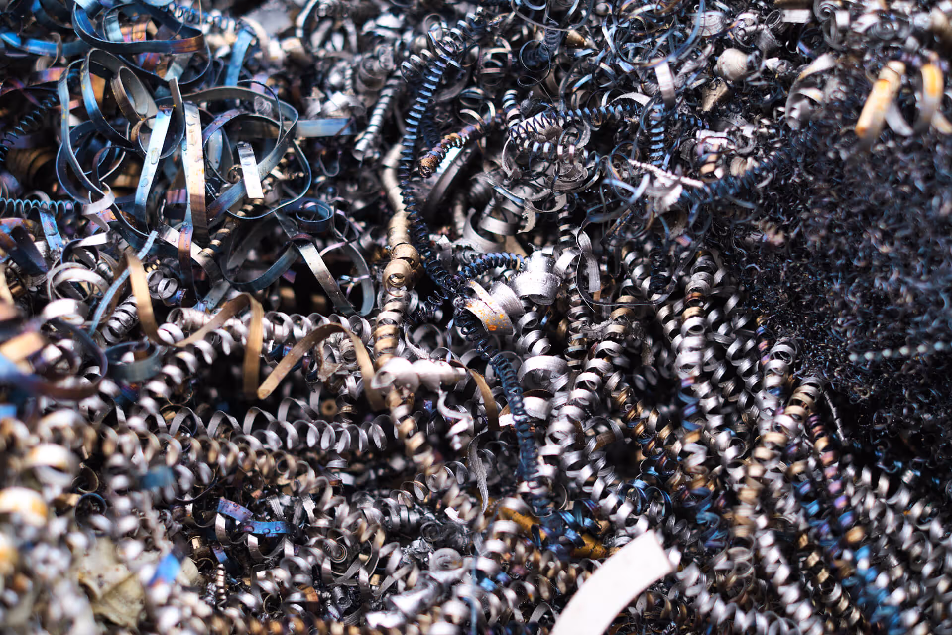 Close-up view of metal shavings and industrial destruction material.