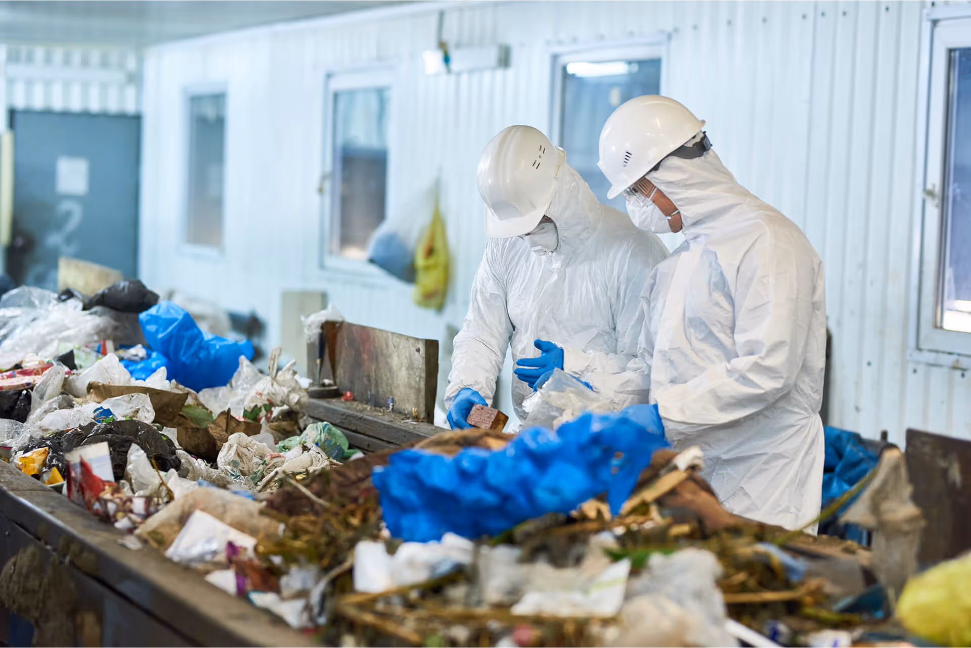 Trash sorting in a waste processing plant.
