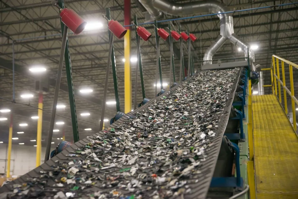 A conveyor belt carrying materials through a processing plant.