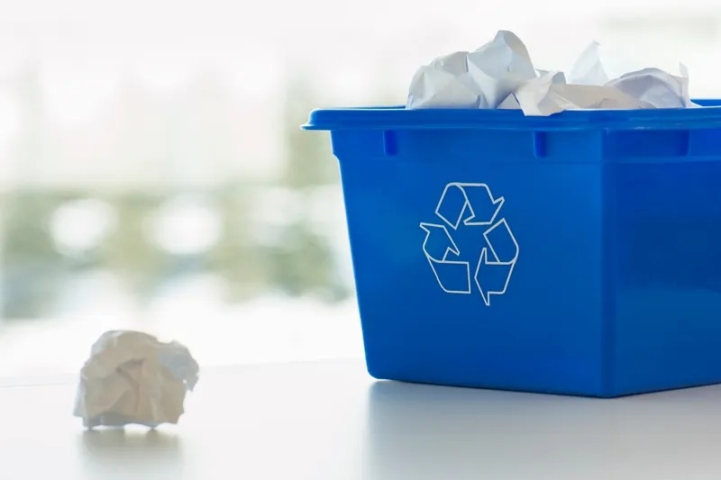 Educational image on office paper recycling, depicting sorting bins and the recycling process for employees.