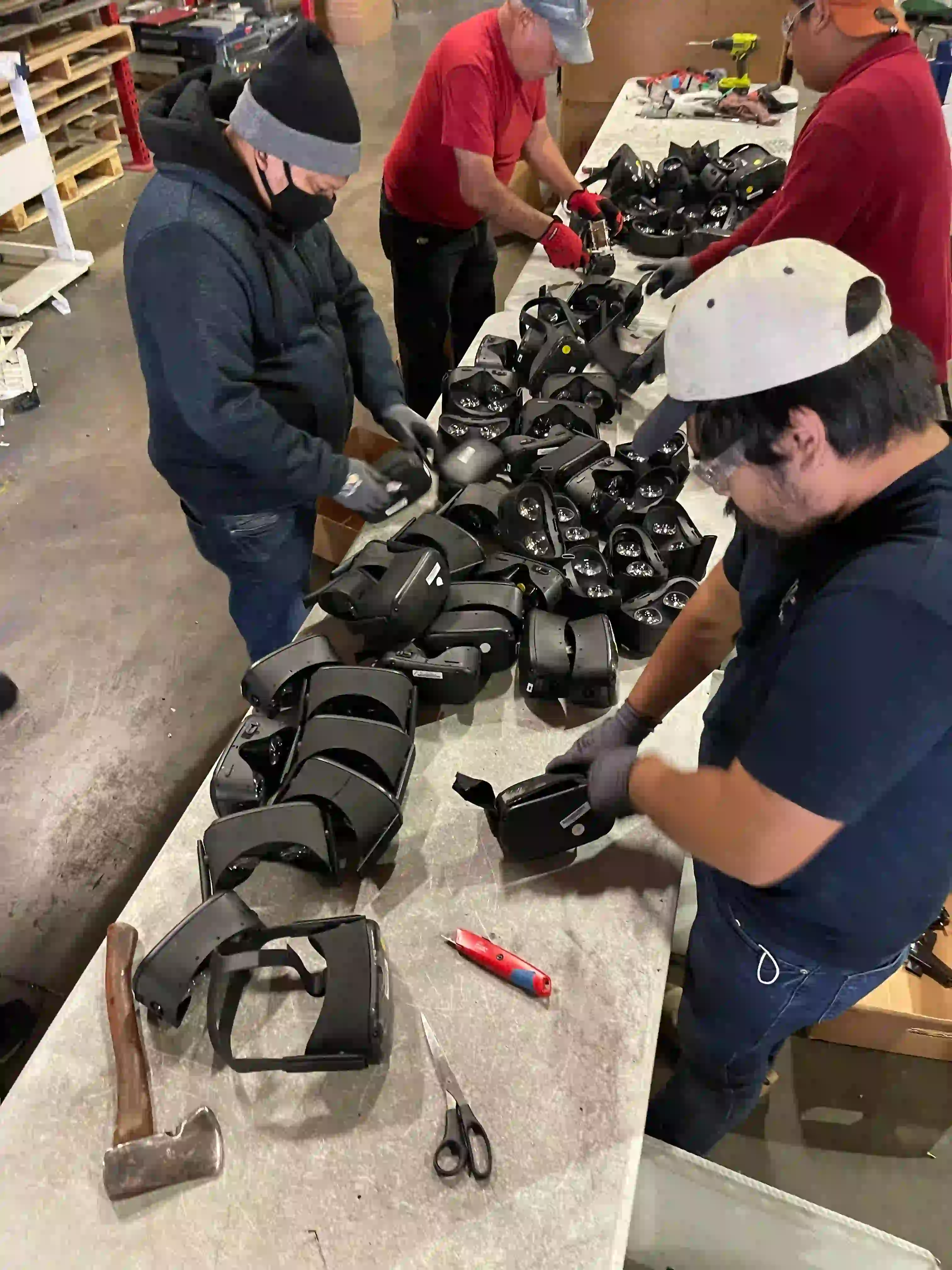 Viking Shred team members dismantling electronic hardware for secure destruction